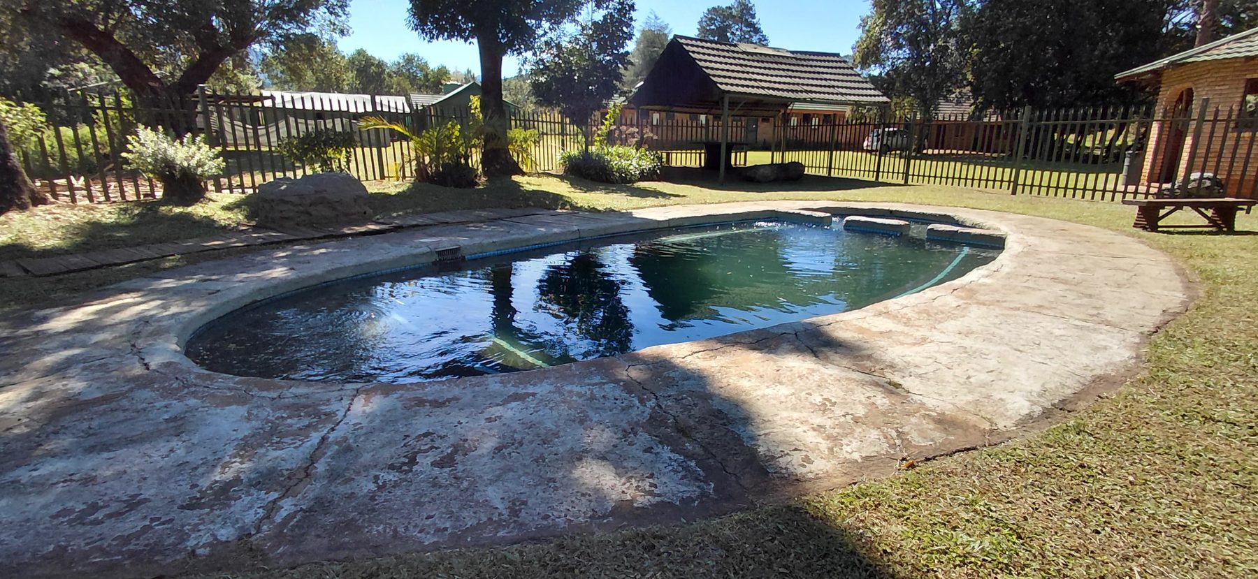 Heated rock pool set into the lawns