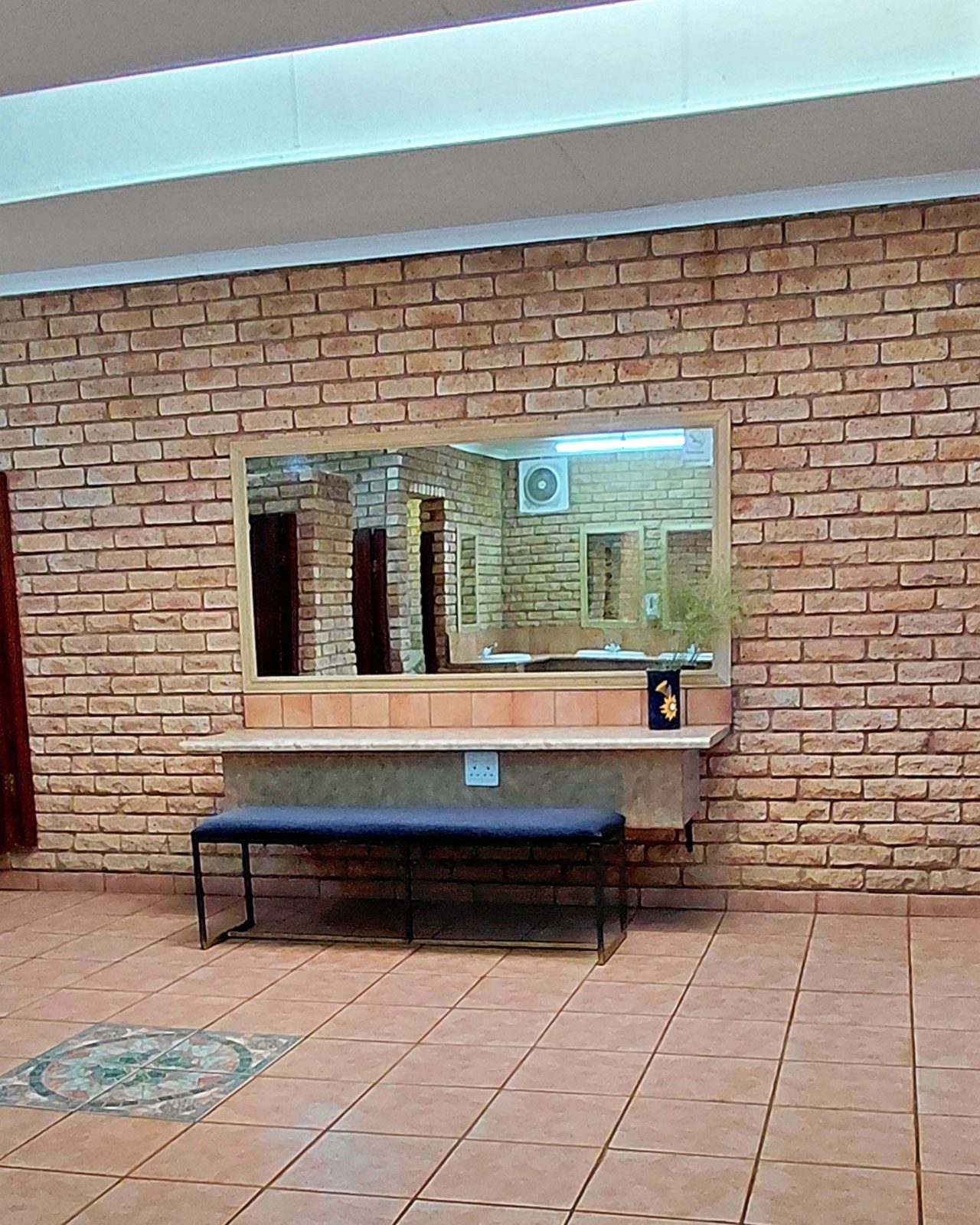 Vanity with basin and mirror in the bathroom facilities